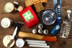 preparedness kit with first aid, hammer, lights, knife