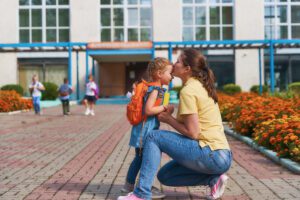 mother in front of school with little girl