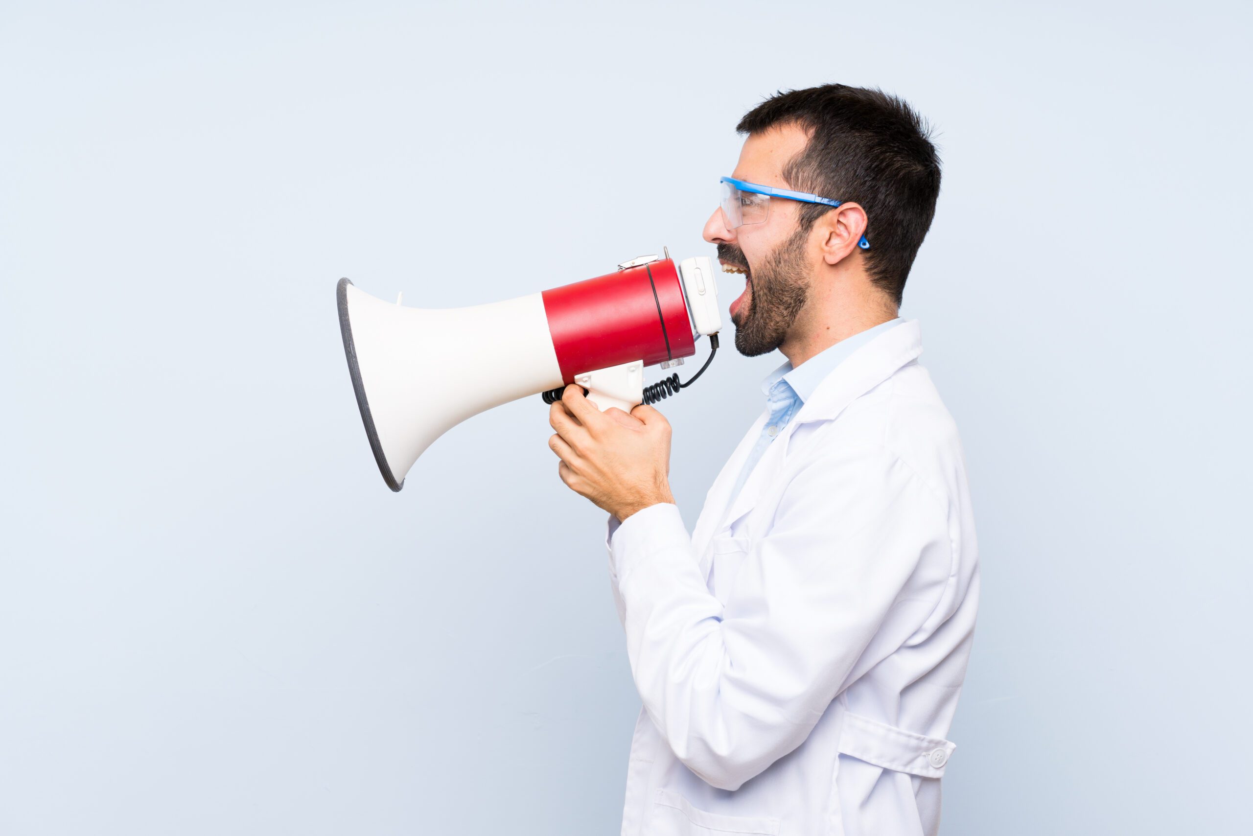 What does the science say? Man in white lab coat with megaphone,