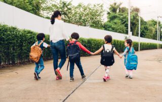 mother practicing parental rights - taking children to school