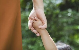 mother and daughter holding hands for parental rights