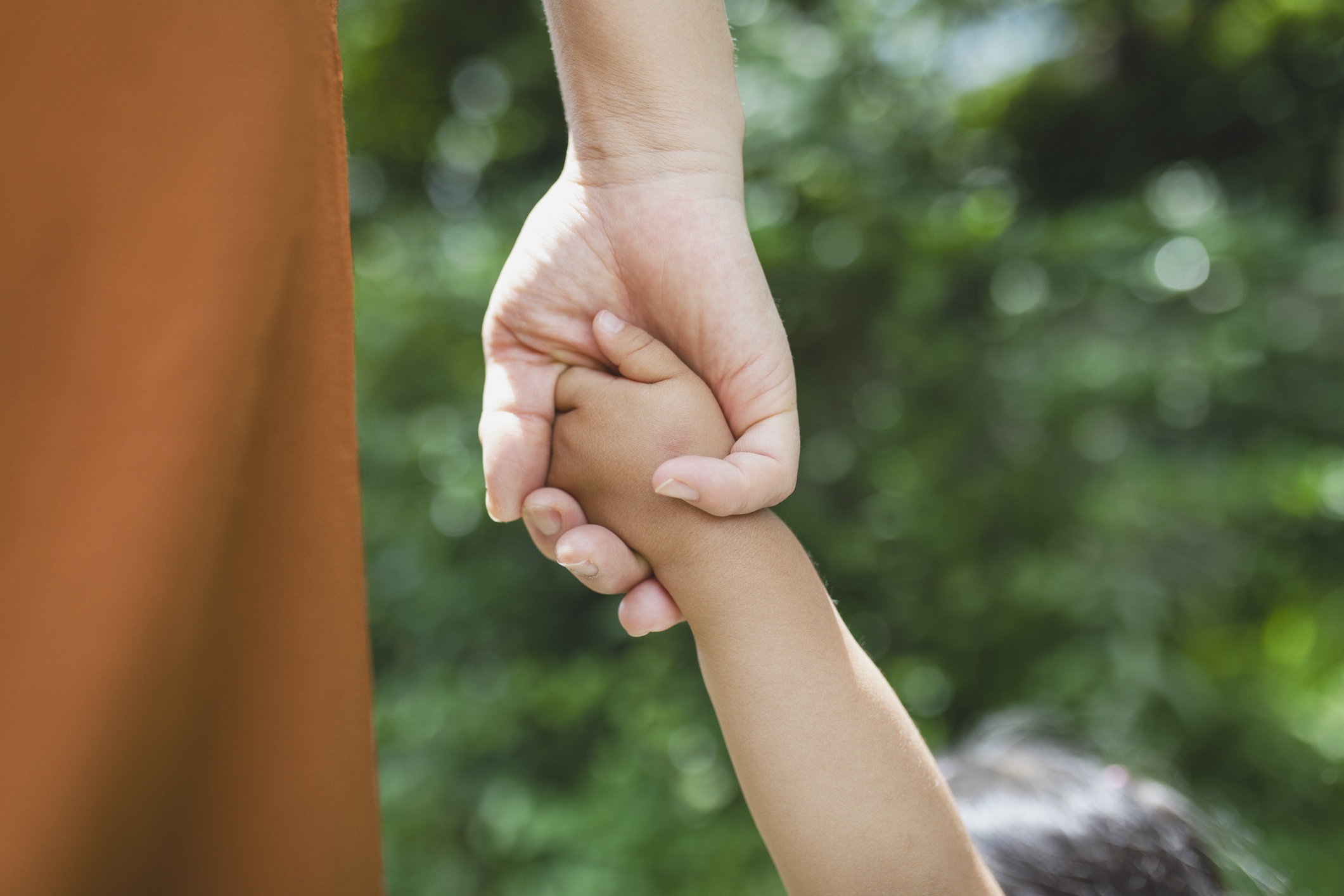 mother and daughter holding hands for parental rights